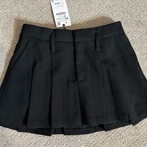 Black pleated micro-mini skirt